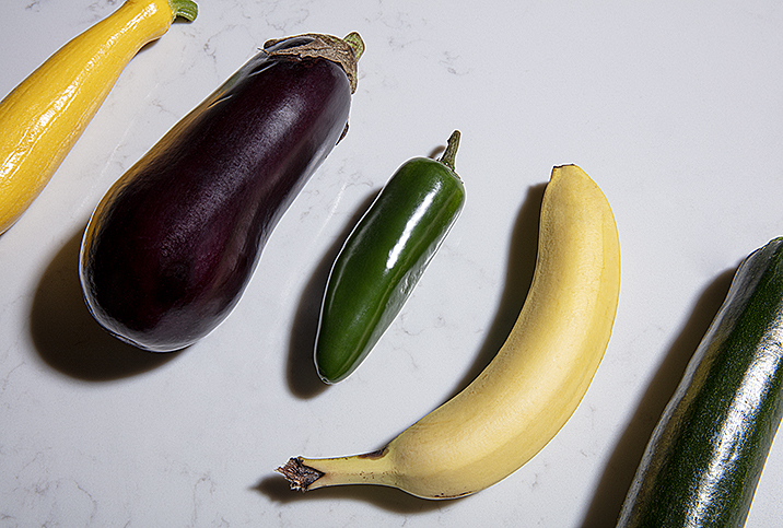 Various phallic vegetables are used to show different sizes and girth of a penis.