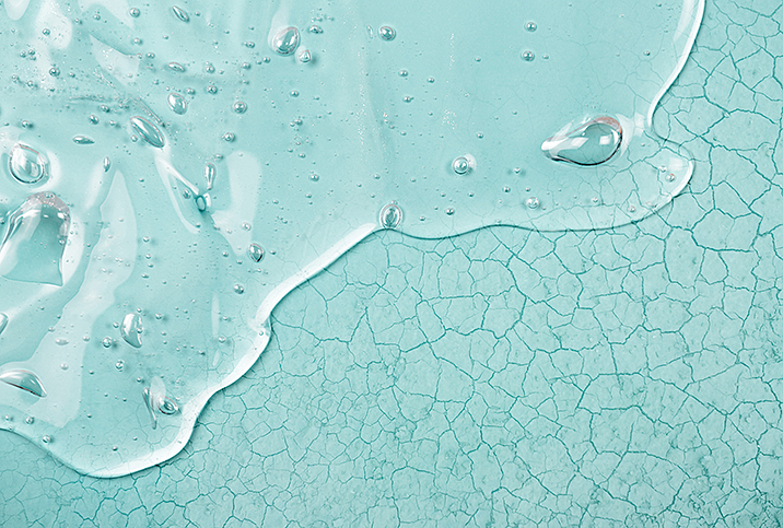 clear lube gel on aqua blue background