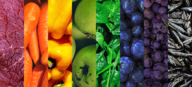 A rainbow gradient comprised of multiple foods.