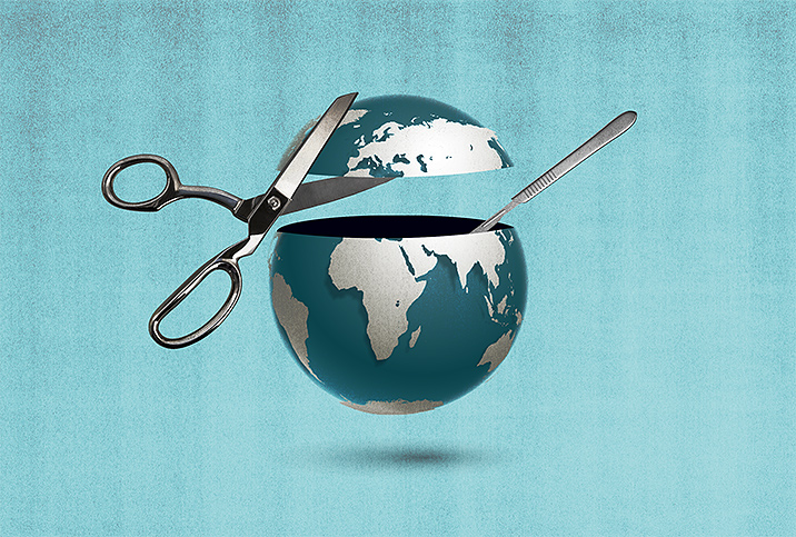 A pair of scissors cuts off the top of a teal and silver planet Earth.