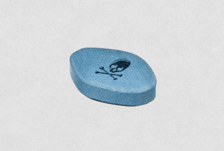 A blue pill for erectile dysfunction has a cross and bones on top of it.