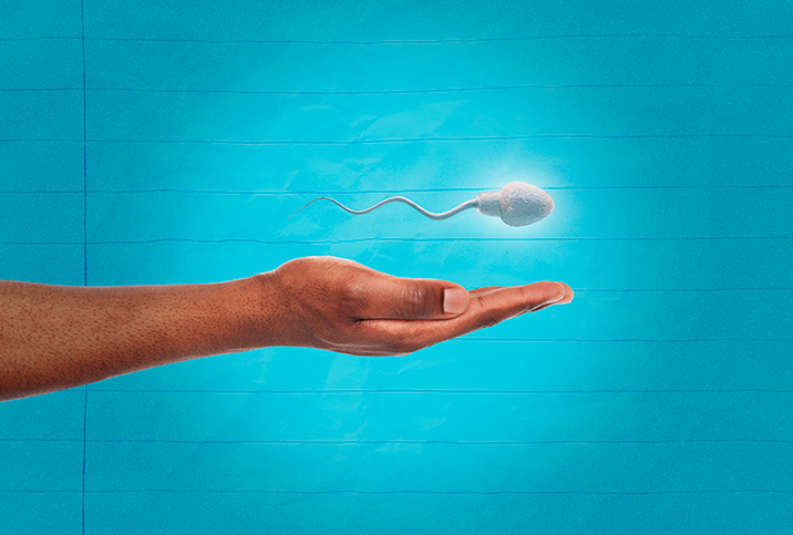 A sperm floats above an man's open hand.