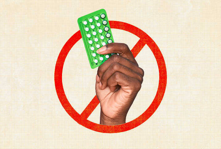 hands holds green birth control pill pack with red slash through it on beige background