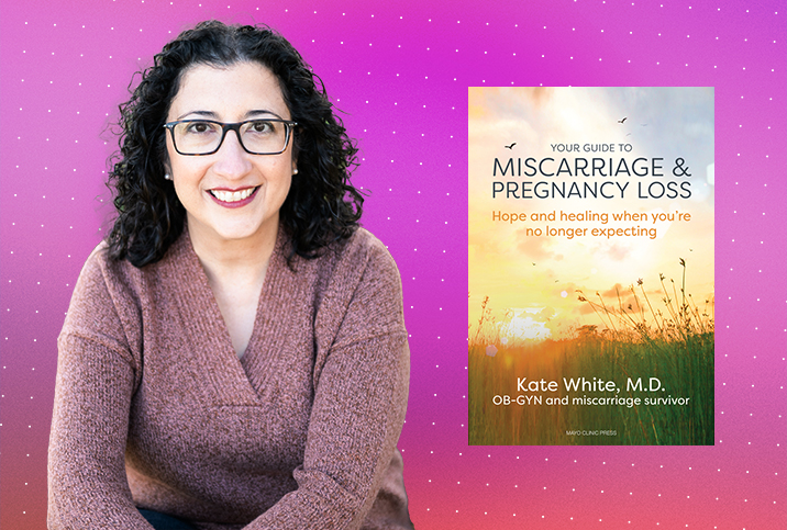 Kate White poses beside her book on pregnancy loss.