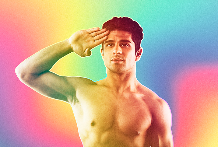 Shirtless-man-soluting-in-front-of-a-rainbow-background