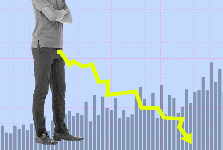 Chart-showing-downward-trend-from-standing-man