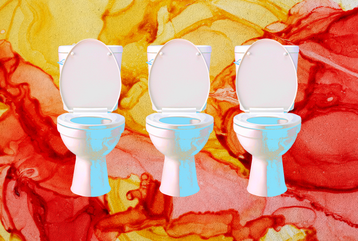 Three toilets sit in front of a yellow and red marbled background.