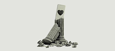 A broken Roman column reveals a cellphone with a heart on the back. 