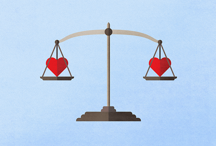 A scale weighs two red hearts, one on each side.