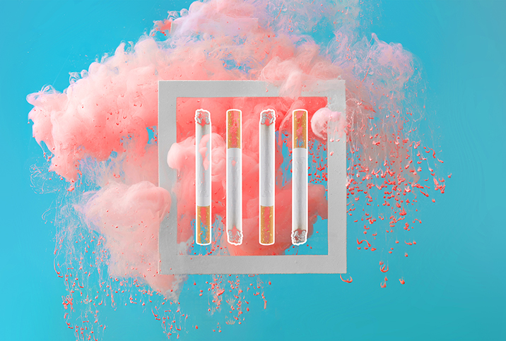 Four-cigarettes-are-in-a-square-in-front-of-a-pink-cloud