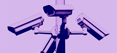 Four security cameras face different directions with a purple filter over the photo.