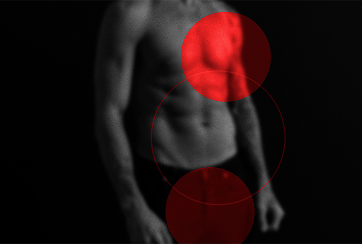 A bright red circle sits over a man's heart while a darker red circle sits over his groin.