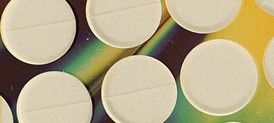 Multiple white opioid pills repeat over a holographic background.