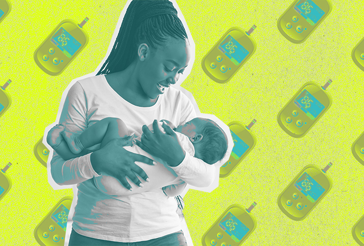 A mom smiles down at the baby in her arms over a background of blood sugar monitors.