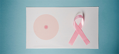 On the left, three pink concentric circles form a breast and nipple, and on the right sits a pink ribbon.