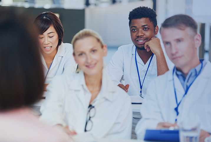 A group of healthcare students listen to an ovarian cancer survivor speak about their experience as a patient.