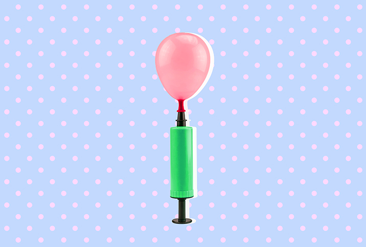 An air pump inflates a pink balloon against a baby blue background with pink dots.