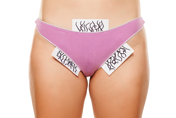 Papers with drawn pubic hair come out the sides of pink underwear that someone is wearing.