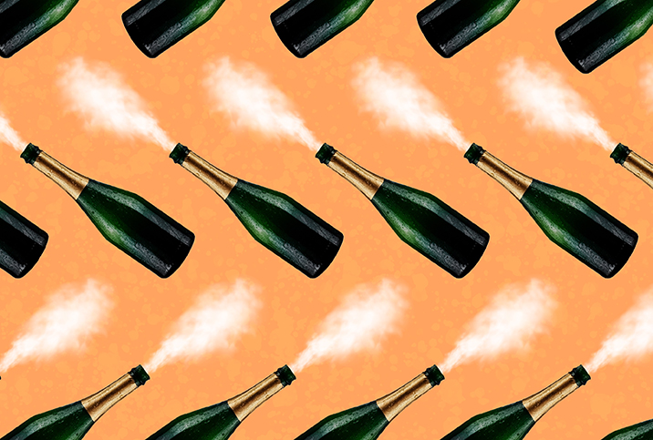 A pattern of champagne bottles are blowing mist instead of liquid against an orange background.