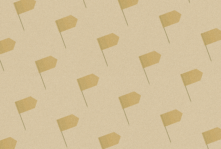 A pattern of dark beige flags repeat against a light beige surface.