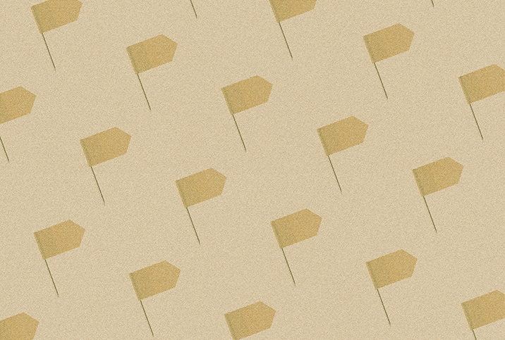 A pattern of dark beige flags repeat against a light beige surface.