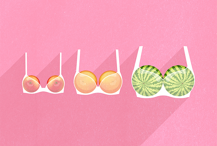 A row of three different sizes of fruit are held in bras against a pink background.