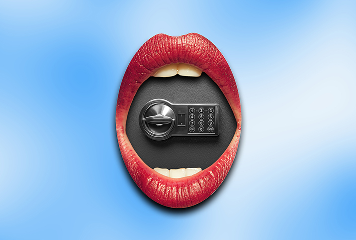 A safe sits inside a pair of red open lips against a blue and white cloudy background.