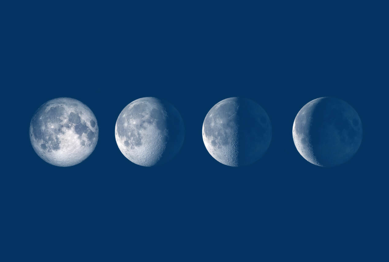 Four phases of the moon are in a row against a blue background.