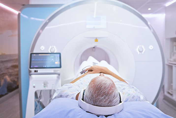 A man lays on an MRI machine for his prostate biopsy.