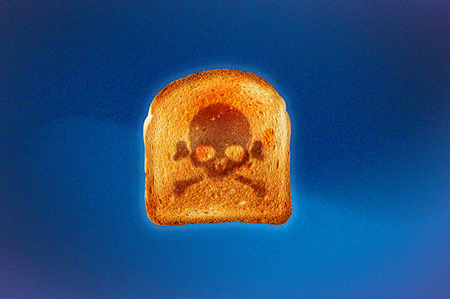 A scull and crossbones is toasted into a slice of bread.