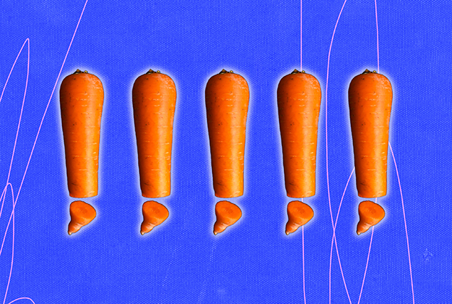 Five carrots are lined up in a row with their tips cut off.