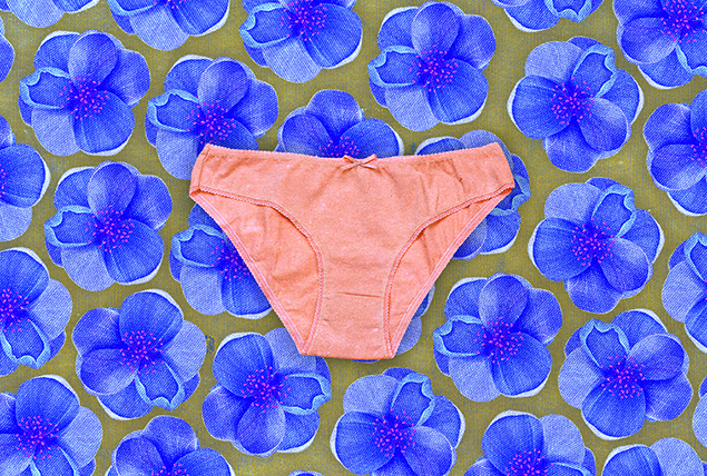 A pink pair of panties float in front of a purple flower motif.