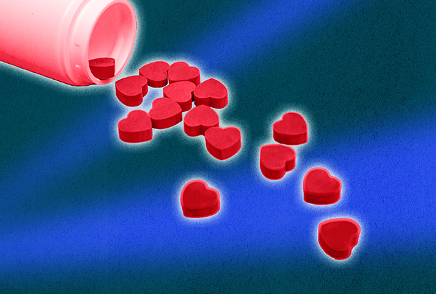 A bottle spills out red heart-shaped pills.