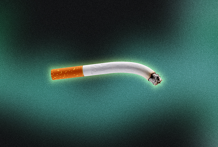A lit cigarette bends downward against a teal and black background.