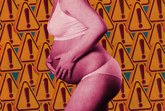 A late-term pregnant woman leans forward holding her stomach against a background of repeated warning signs.