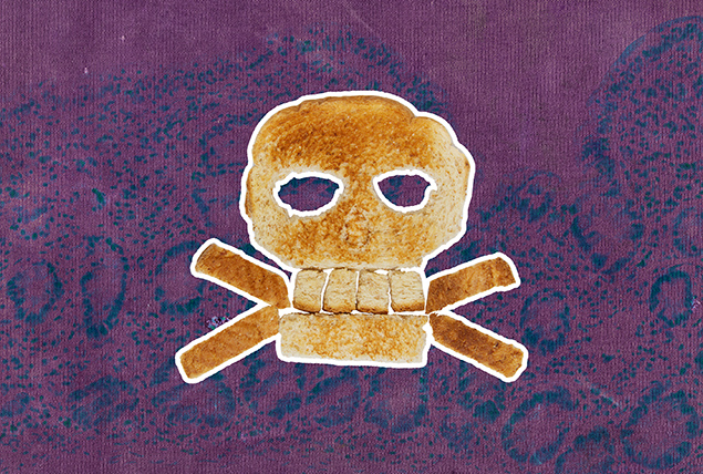 A piece of bread in the shape of a skull and cross bones is layered on a pink and purple marbled background.