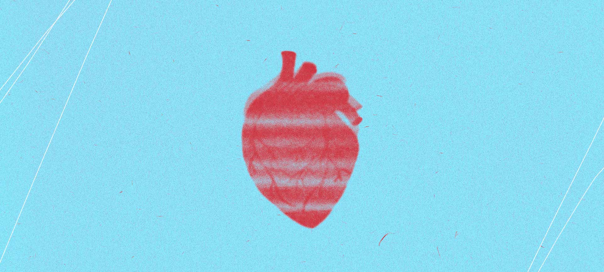 A red semi-transparent human heart with white stripes is blurred against a light blue background.