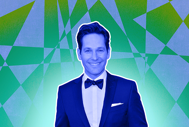 Paul Rudd is in a black-tie suit against a green and white patterned background.