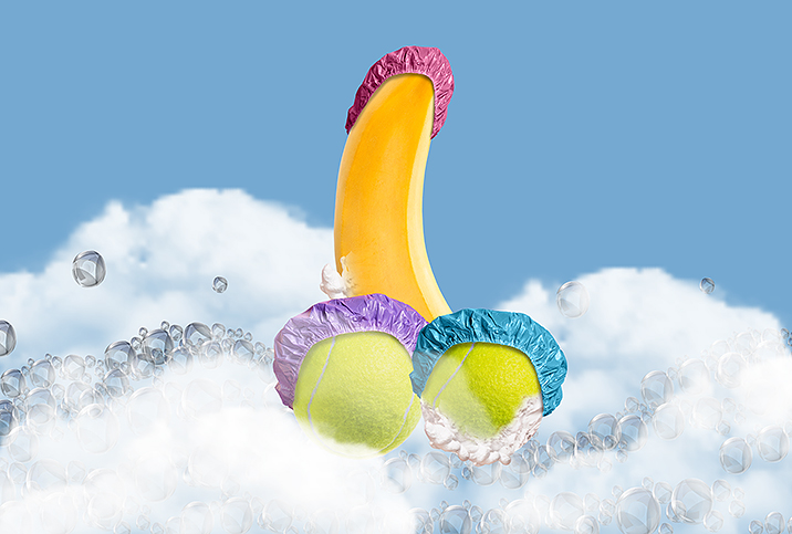 A banana sits between two tennis balls up in the clouds with shower caps on all three parts.