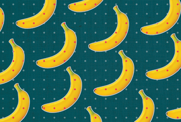 pattern of bananas with red spots on teal background