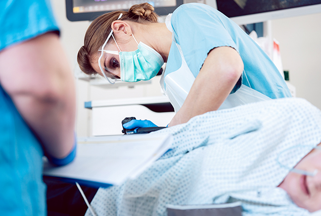 A nurse performs a screening test for colorectal cancer.