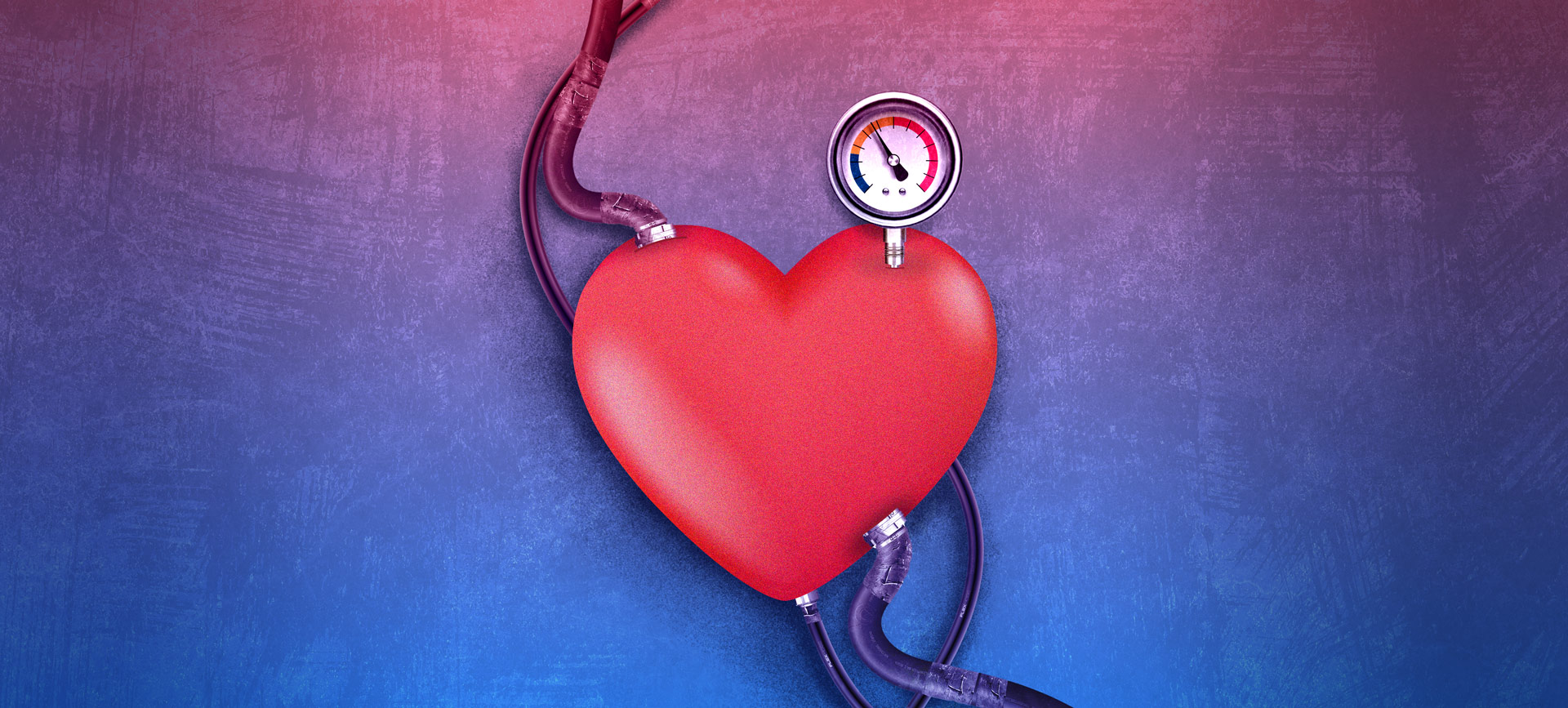 red heart with tubes coming out of it and a pressure gauge on top on a blue background