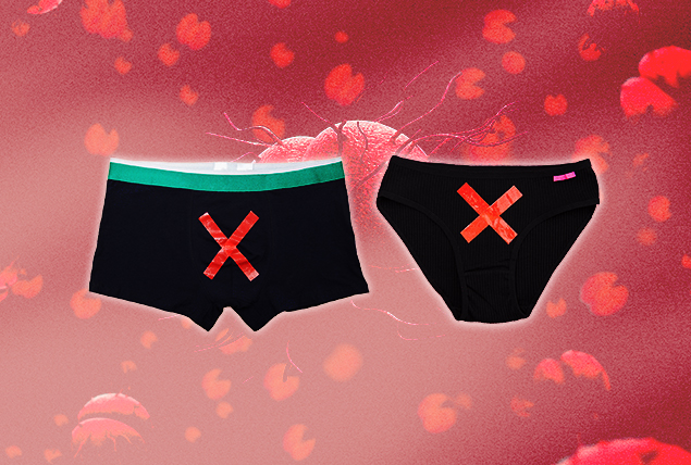 two pairs of black underwear with red x's on a red spotted background