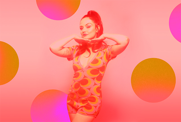 actress Emily Meade with a pink tint on a pink background with circles