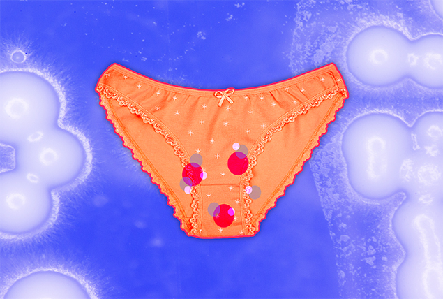 orange pair of underwear with red and purple circles on a purple background