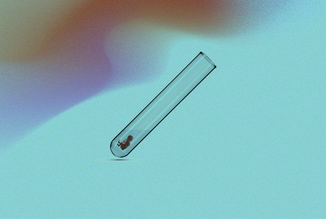 baby fetus in test tube on blue and marbled background