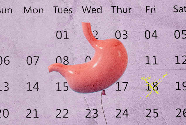 pink stomach balloon on mauve calendar background