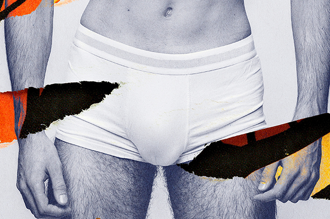 An advertisement of a man in white underwear is torn on each side.