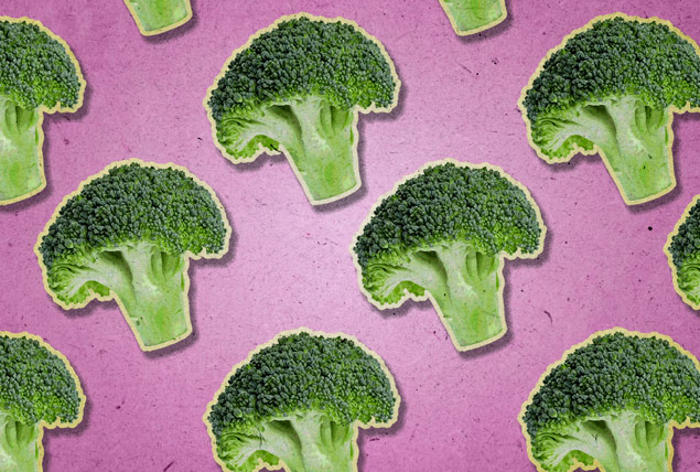 green broccoli florets on pink background 
