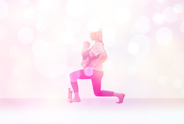 woman in workout clothes with a pink tiny lunges with baby in her arms